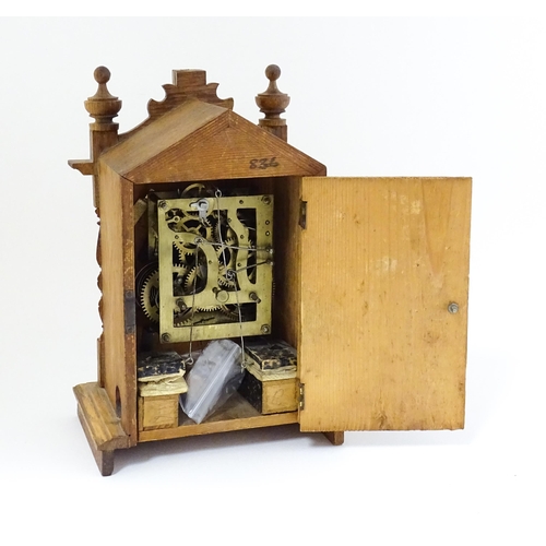 1547 - An oak mantel clock with cuckoo to top. Approx 9 1/2