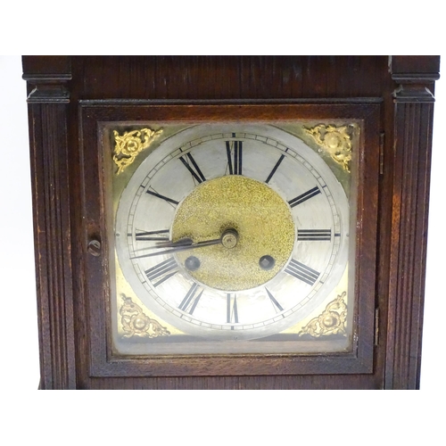 1547A - A continental oak cased mantle clock with silvered chapter ring , the 8-day movement striking on a g... 