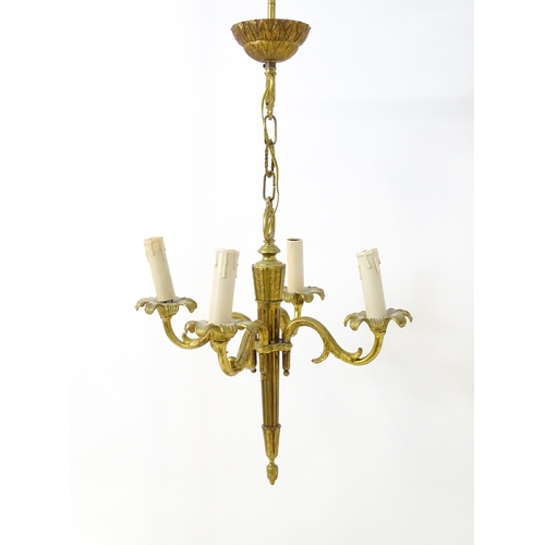 1561 - A four branch gilt metal pendant electrolier / light with acanthus detail. Approx. 25