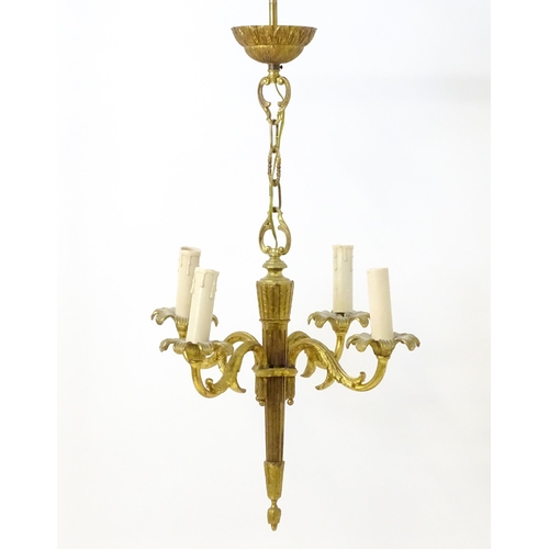 1561 - A four branch gilt metal pendant electrolier / light with acanthus detail. Approx. 25