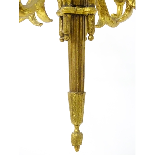 1561 - A four branch gilt metal pendant electrolier / light with acanthus detail. Approx. 25