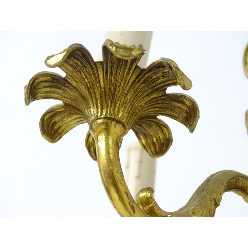 1561 - A four branch gilt metal pendant electrolier / light with acanthus detail. Approx. 25