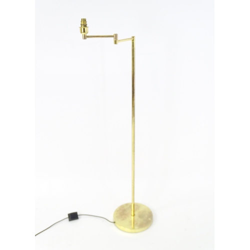 1564A - A brass standard lamp with adjustable arm. Approx 54