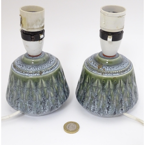 1569 - A pair of retro ceramic table lamps with a mottled green glaze detail. Approx. 6