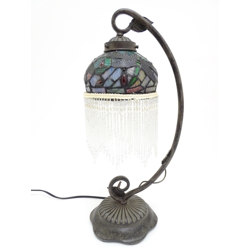 1579 - A Tiffany style table lamp with dragon fly detail to shade. The whole approx 19