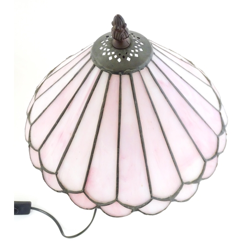 1580 - A Tiffany style table lamp with pink leaded glass shade. the whole approx 17