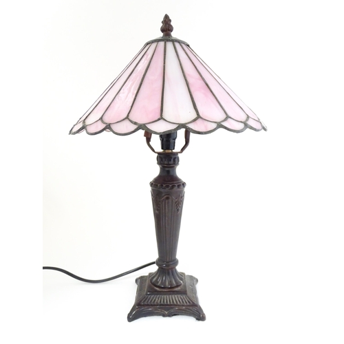 1580 - A Tiffany style table lamp with pink leaded glass shade. the whole approx 17