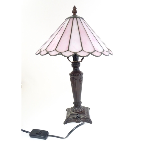 1580 - A Tiffany style table lamp with pink leaded glass shade. the whole approx 17