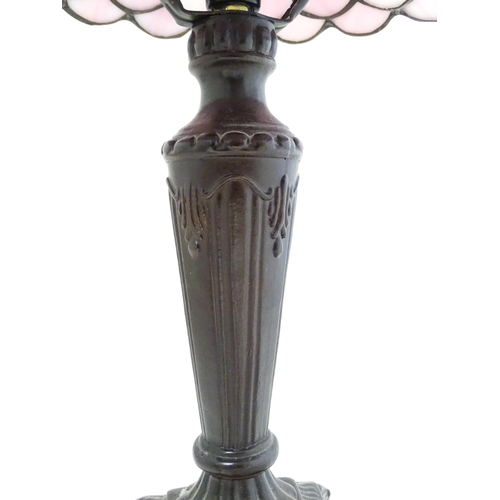 1580 - A Tiffany style table lamp with pink leaded glass shade. the whole approx 17