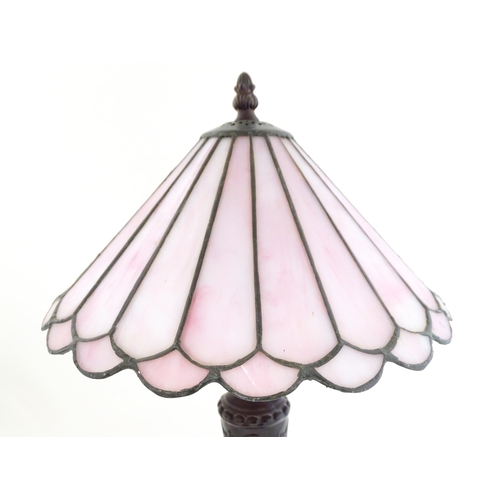 1580 - A Tiffany style table lamp with pink leaded glass shade. the whole approx 17