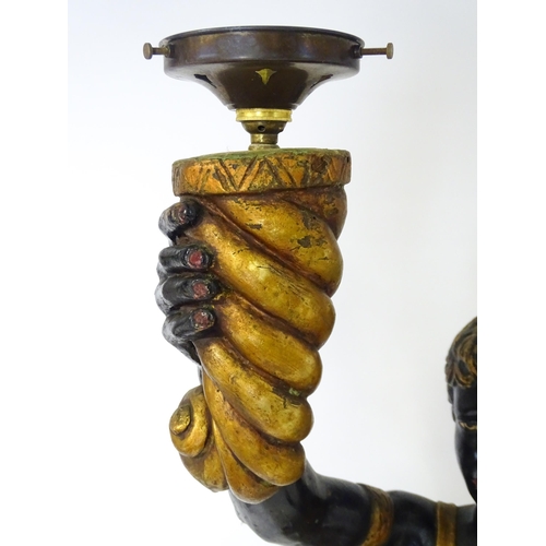 1589 - Two mid 20thC blackamoor lamps, the lamps having a polychrome figural top grasping a torchiere, the ... 