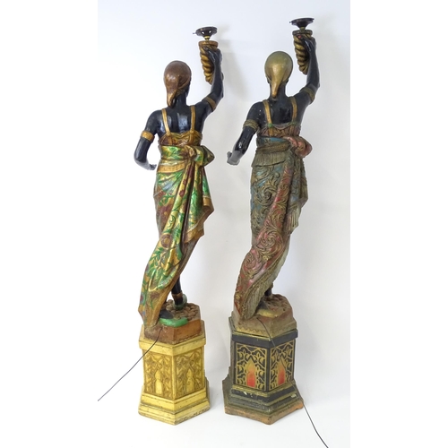 1589 - Two mid 20thC blackamoor lamps, the lamps having a polychrome figural top grasping a torchiere, the ... 