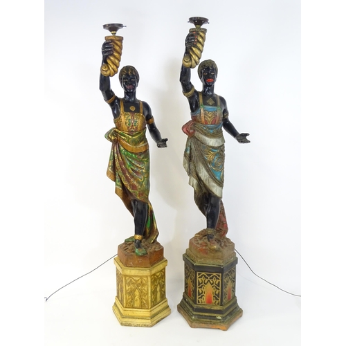 1589 - Two mid 20thC blackamoor lamps, the lamps having a polychrome figural top grasping a torchiere, the ... 