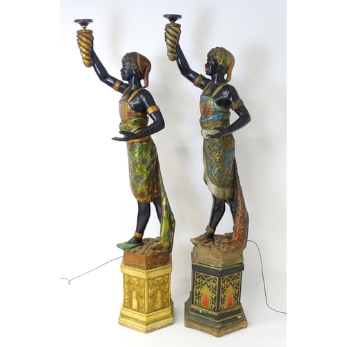 1589 - Two mid 20thC blackamoor lamps, the lamps having a polychrome figural top grasping a torchiere, the ... 