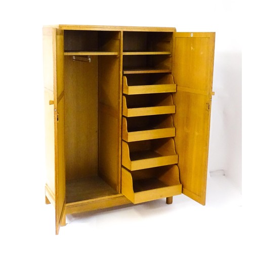 1627 - An early / mid 20thC oak utilitarian wardrobe in the Art Deco style. Designed and made by Brynmawr F... 