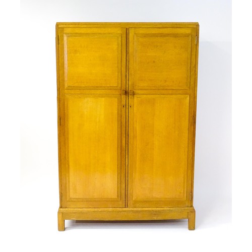 1627 - An early / mid 20thC oak utilitarian wardrobe in the Art Deco style. Designed and made by Brynmawr F... 