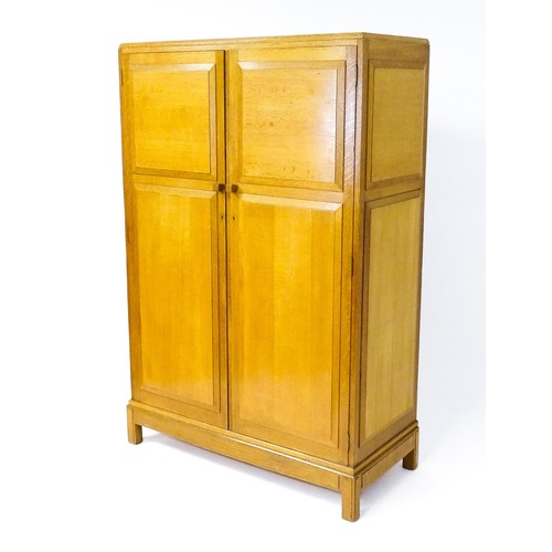 1627 - An early / mid 20thC oak utilitarian wardrobe in the Art Deco style. Designed and made by Brynmawr F... 