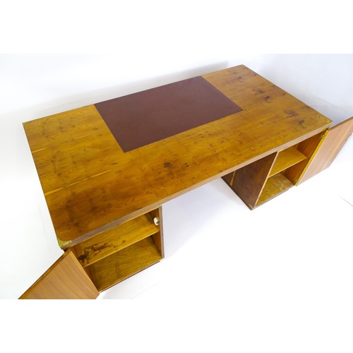 1667 - A campaign style yew wood veneered partners desk, with brass mounts to the corners of the desk top a... 