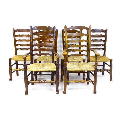 1716 - A group of six envelope seated ladderback chairs (4+2) raised on turned tapering front legs terminat... 