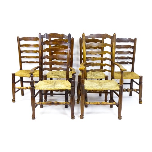 1716 - A group of six envelope seated ladderback chairs (4+2) raised on turned tapering front legs terminat... 