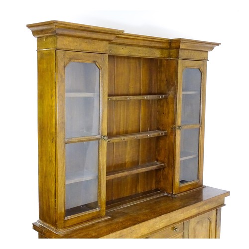 1728 - An early 20thC oak and burr walnut veneered dresser with a moulded cornice over two glazed cupboards... 