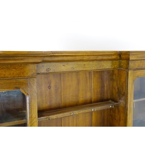 1728 - An early 20thC oak and burr walnut veneered dresser with a moulded cornice over two glazed cupboards... 