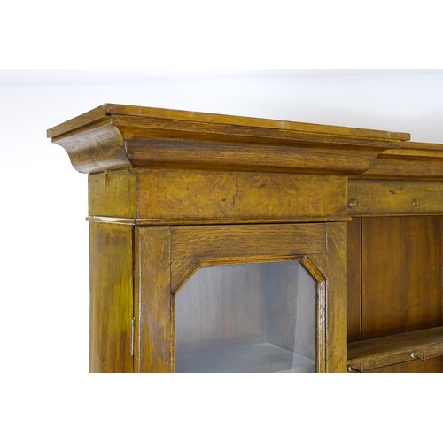 1728 - An early 20thC oak and burr walnut veneered dresser with a moulded cornice over two glazed cupboards... 