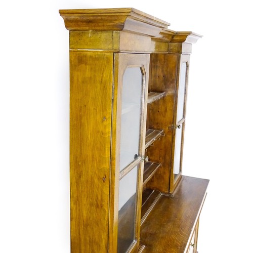 1728 - An early 20thC oak and burr walnut veneered dresser with a moulded cornice over two glazed cupboards... 