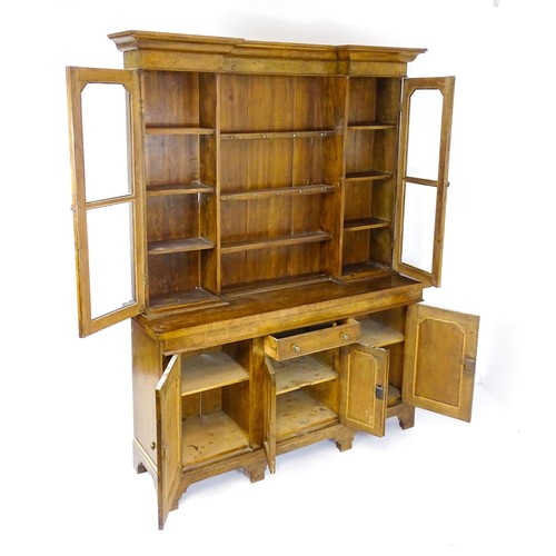 1728 - An early 20thC oak and burr walnut veneered dresser with a moulded cornice over two glazed cupboards... 