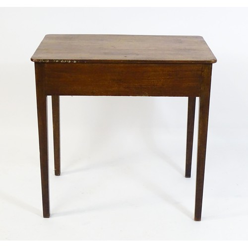 1666 - An early 19thC mahogany side table with a single short drawer to one end and raised on four tapering... 