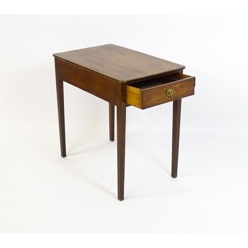 1666 - An early 19thC mahogany side table with a single short drawer to one end and raised on four tapering... 