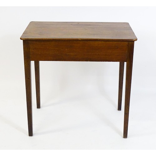 1666 - An early 19thC mahogany side table with a single short drawer to one end and raised on four tapering... 