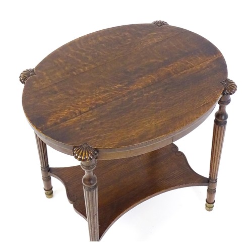 1794 - A 19thC oak occasional table with an oval top raised on four turned reeded legs with gadrooned termi... 