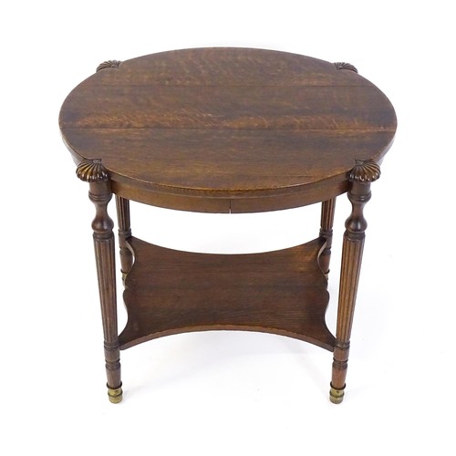 1794 - A 19thC oak occasional table with an oval top raised on four turned reeded legs with gadrooned termi... 