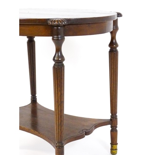 1794 - A 19thC oak occasional table with an oval top raised on four turned reeded legs with gadrooned termi... 