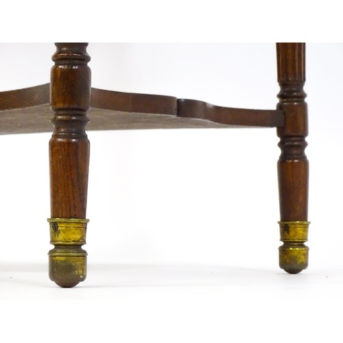 1794 - A 19thC oak occasional table with an oval top raised on four turned reeded legs with gadrooned termi... 