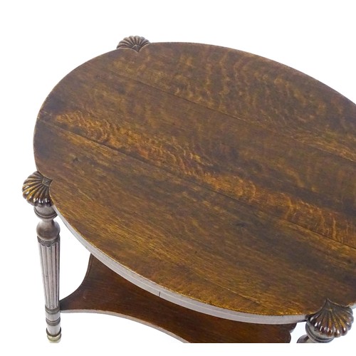 1794 - A 19thC oak occasional table with an oval top raised on four turned reeded legs with gadrooned termi... 