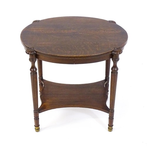 1794 - A 19thC oak occasional table with an oval top raised on four turned reeded legs with gadrooned termi... 