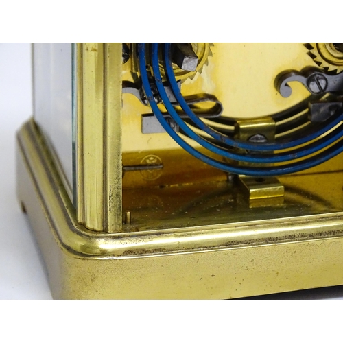 1536 - A late 19th / early 20thC French brass corniche cased carriage clock, by Richard & Cie. Having ename... 