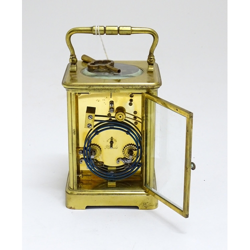 1536 - A late 19th / early 20thC French brass corniche cased carriage clock, by Richard & Cie. Having ename... 