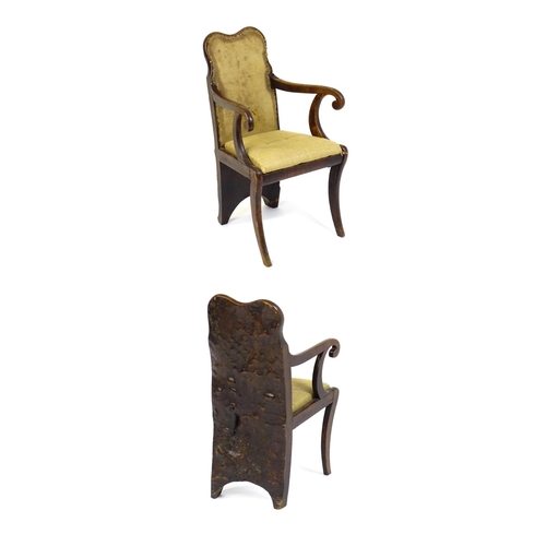 1606 - A Regency period rare 'Dug-out' chair, with a single large piece of wood forming the backrest and ba... 