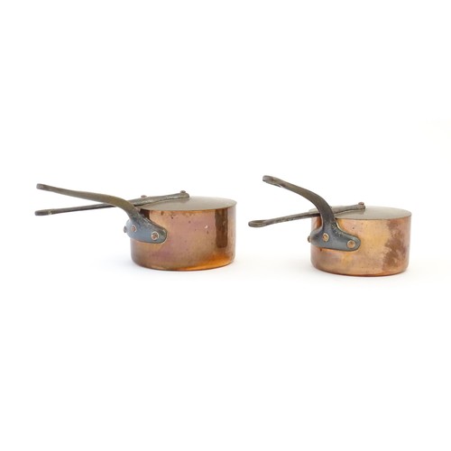 1203 - Two French Villedieu copper pans and lids with iron handles. Stamped to side. Largest approx. 14 1/2... 