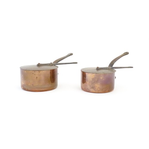 1203 - Two French Villedieu copper pans and lids with iron handles. Stamped to side. Largest approx. 14 1/2... 