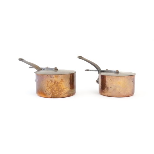 1203 - Two French Villedieu copper pans and lids with iron handles. Stamped to side. Largest approx. 14 1/2... 