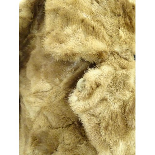 91 - A vintage short length fur coat / jacket. Approx. UK size 8