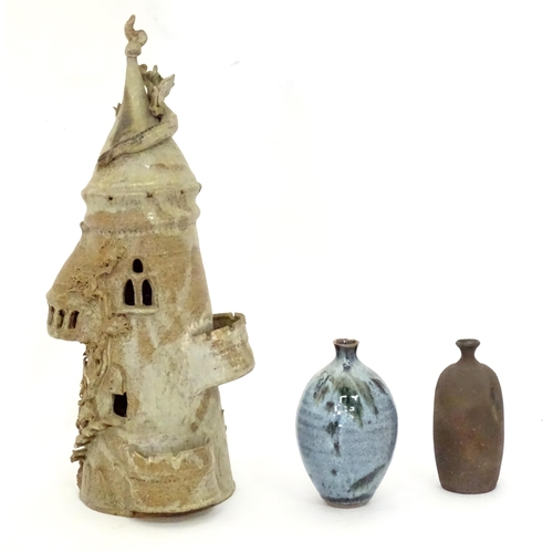 114 - Three items of studio pottery to include a model of a tower with turrets and dragon detail by a loca... 