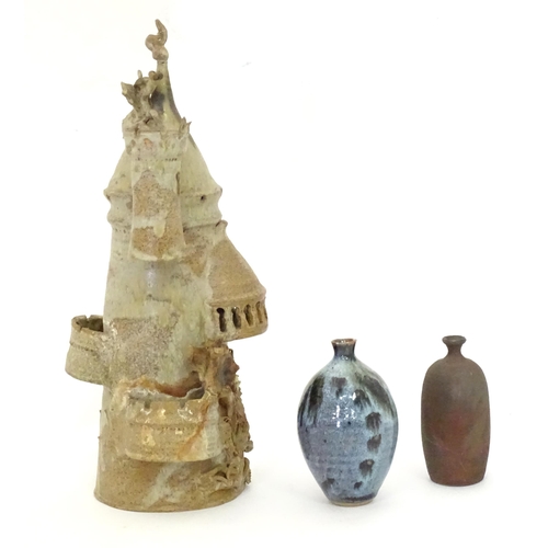 114 - Three items of studio pottery to include a model of a tower with turrets and dragon detail by a loca... 