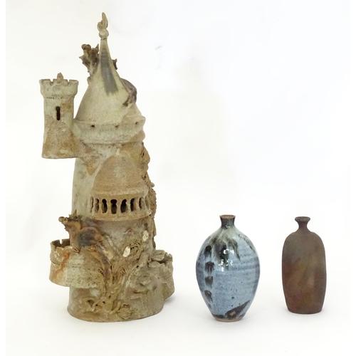 114 - Three items of studio pottery to include a model of a tower with turrets and dragon detail by a loca... 