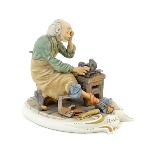 118 - An Italian Capodimonte model of a Ciabattino / Cobbler, titled to base and signed Milio. Marked unde... 