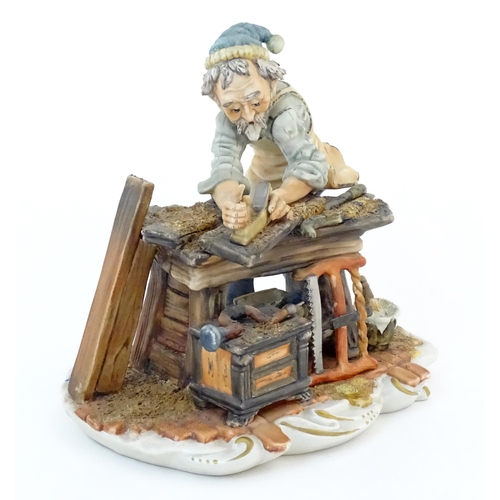 119 - An Italian Capodimonte model of a Carpenter, and signed Milio. Marked under with pattern no. 162. Ap... 